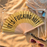 Gold glitter hand fan 'its fucking hot’